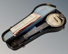 A British Made mini 8 string banjo in case