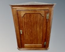 A Victorian oak hanging corner cabinet