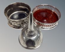 An antique French pewter wine funnel together with two silver plated wine coasters
