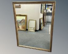 A contemporary gilded mirror,