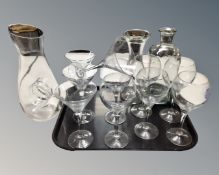 Two trays of assorted glass ware : drinking glasses, wine carafes,