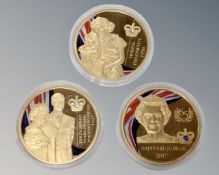 Three gold plated Elizabeth II commemorative coins