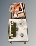 A vintage reel to reel player together with box of reels