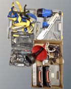 A Mac-Afric nail gun in case together with a box of ratchet straps, Ryobi heat gun,