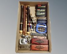 A box of assorted harmonias, chromonicas,