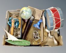 A box of vintage toys : drum and sticks, tin plate globe, tin plate miniature pond yacht,