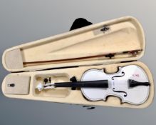 A violin and bow in carry case,