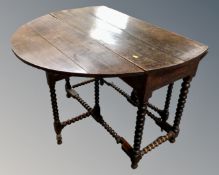 A 19th century oak gate leg table on bobbin legs.