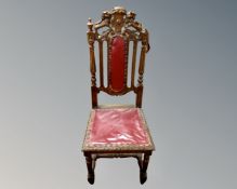 An Edwardian carved hall chair.