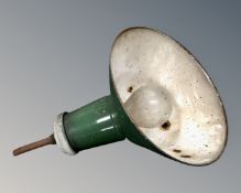 A vintage industrial green enamelled metal light fitting.
