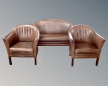 A three piece reception suite comprising of a settee and two tub chairs,