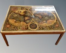 A Continental brass framed coffee table depicting a map of the world.