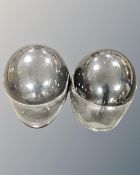 Two motorcycle helmets.