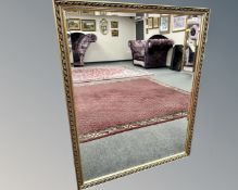 A contemporary gilded mirror,