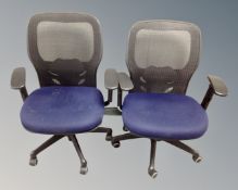 Two contemporary office adjustable swivel armchairs with fabric seats and mesh backs.