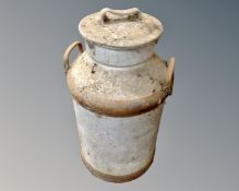 An aluminium milk churn.