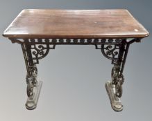 An antique cast iron pedestal pub table.