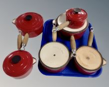 Six Cousances enamelled wooden handled saucepans.