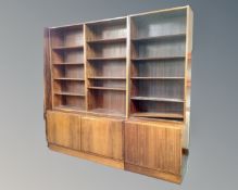 A mid-20th century Danish rosewood open bookcase fitted with cupboards below.