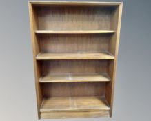 A set of mid-20th century teak open bookshelves.