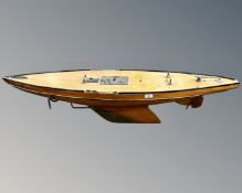 A 20th century wooden pond yacht on stand,