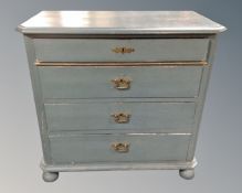 A 19th century Scandinavian painted pine four drawer chest on bun feet.