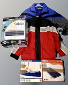 A box containing three boxed air beds and two gent's outdoor coats.