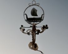 A cast iron three-way light fitting together with a cast iron wall light with double candle sconce