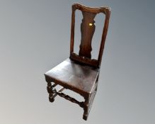 A Georgian oak hall chair.