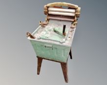 A vintage galvanised wash tub with mangle