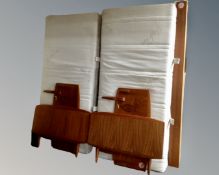 A pair of 20th century teak 3' bedframes with interiors.