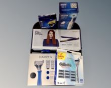 A tray of cosmetics including two boxed Harry's Razors box sets, a Gillette razor box set,
