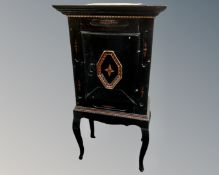 A 19th century painted oak cabinet on raised legs.