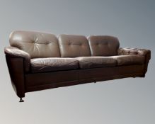 A 20th century Scandinavian brown button leather three seater settee.
