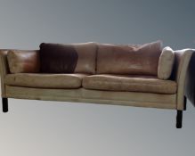 A 20th century Scandinavian tan leather settee.