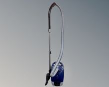 A Miele vacuum cleaner.