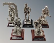 A group of five Royal Hampshire silvered metal figures depicting soldiers.