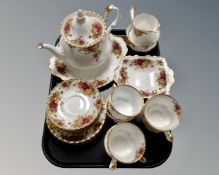 A collection of 22 pieces of Royal Albert Old Country Roses tea china.