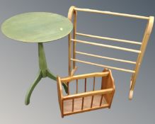 A contemporary circular pedestal occasional together with a towel rail and a magazine rack.