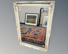 A contemporary cream mirror, 75cm by 106cm.