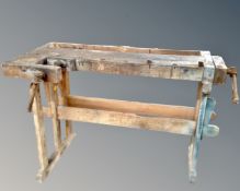 A vintage Scandinavian woodworking bench, on stand with vice.