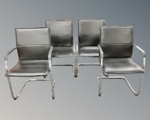 A set of four black leather tubular metal framed stacking office armchairs.