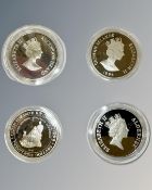 Four silver proof coins, each weighing 28.