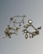 Three silver charm bracelets, 105g.