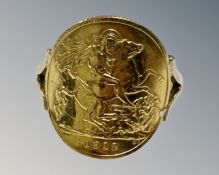 A 9ct yellow gold George V 1912 half sovereign ring, size Q,