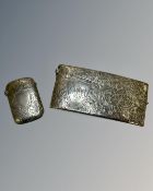 A silver vest case together with a silver card case.