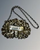 A Georgian silver whisky label, by John Thornton, Birmingham 1830 marks.