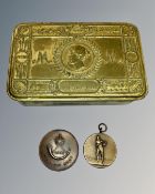 A World War I Christmas tin together with two medallions,