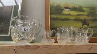 Six glass jugs.