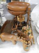 A mixed lot of wooden bowls and other wooden items.